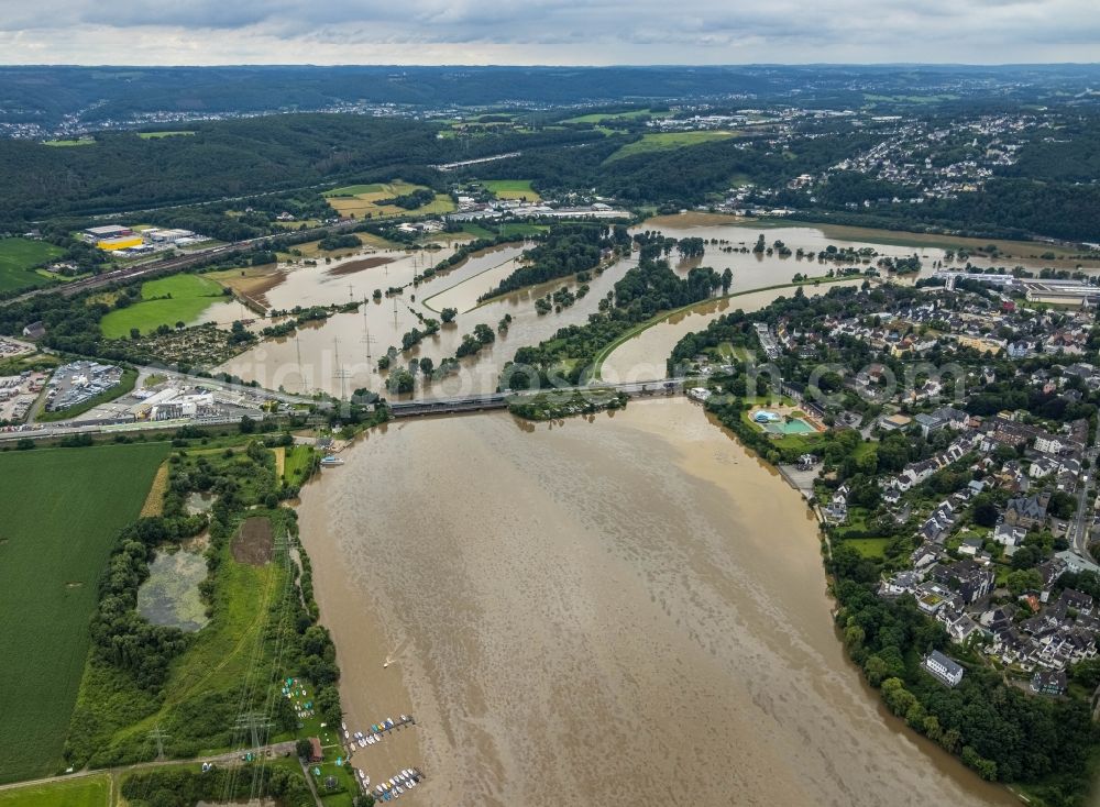 Wetter (Ruhr) from the bird's eye view: Flood situation and flooding, all-rousing and infrastructure-destroying masses of brown water on the river course of the Ruhr at the Obergrabenbruecke in Wetter (Ruhr) at Ruhrgebiet in the state North Rhine-Westphalia, Germany