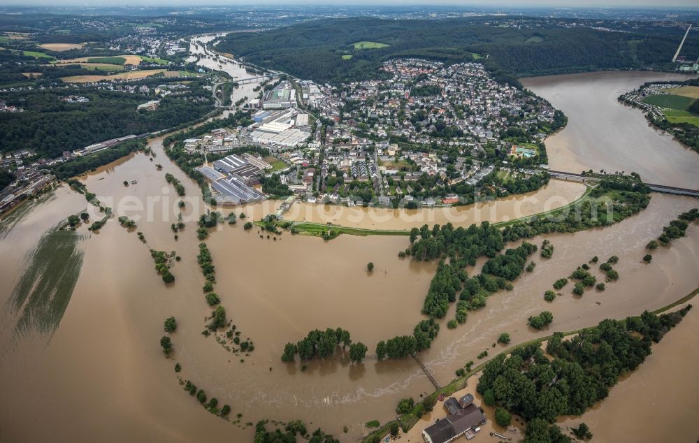 Wetter (Ruhr) from above - Flood situation and flooding, all-rousing and infrastructure-destroying masses of brown water on the river course of Ruhr in Wetter (Ruhr) at Ruhrgebiet in the state North Rhine-Westphalia, Germany