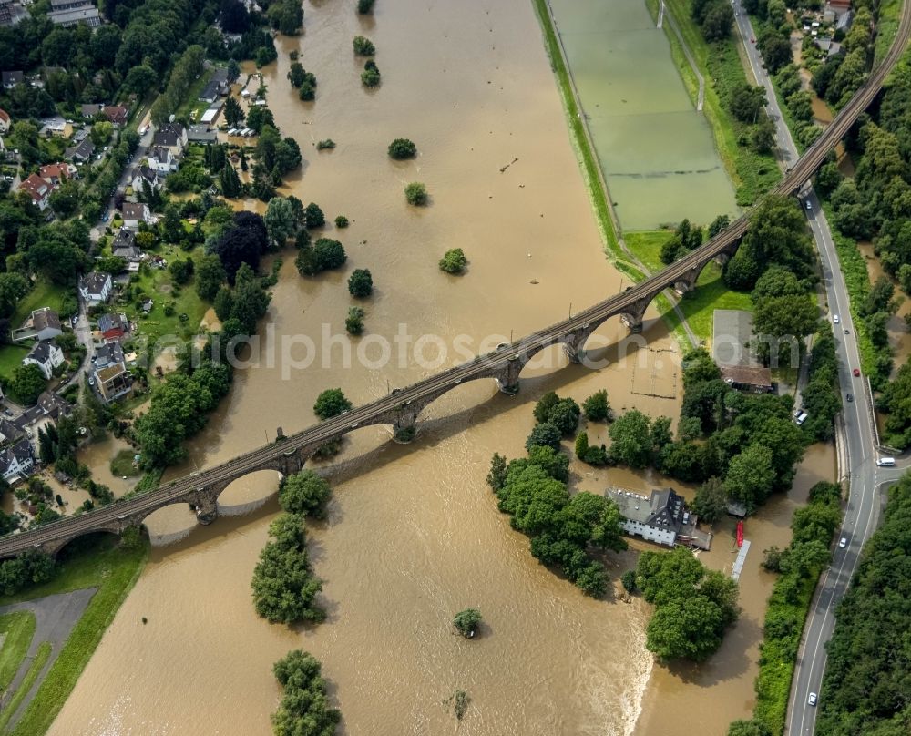 Witten from the bird's eye view: Flood situation and flooding, all-rousing and infrastructure-destroying masses of brown water on the course of the river Ruhr in Witten at Ruhrgebiet in the state North Rhine-Westphalia, Germany