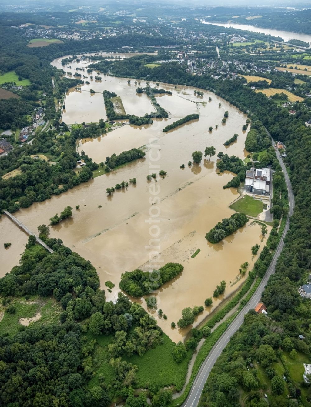 Witten from the bird's eye view: Flood situation and flooding, all-rousing and infrastructure-destroying masses of brown water on the course of the river Ruhr in Witten at Ruhrgebiet in the state North Rhine-Westphalia, Germany