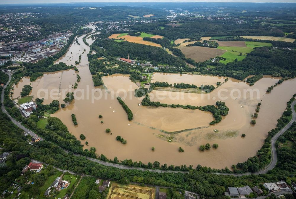 Witten from the bird's eye view: Flood situation and flooding, all-rousing and infrastructure-destroying masses of brown water on the course of the river Ruhr in Witten at Ruhrgebiet in the state North Rhine-Westphalia, Germany