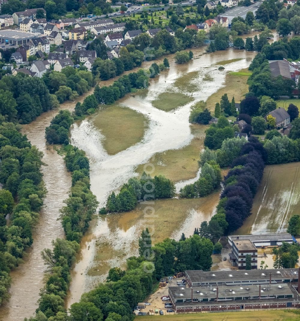 Aerial image Hagen - Flood situation and flooding, all-rousing and infrastructure-destroying masses of brown water in the district Hohenlimburg in Hagen at Ruhrgebiet in the state North Rhine-Westphalia, Germany