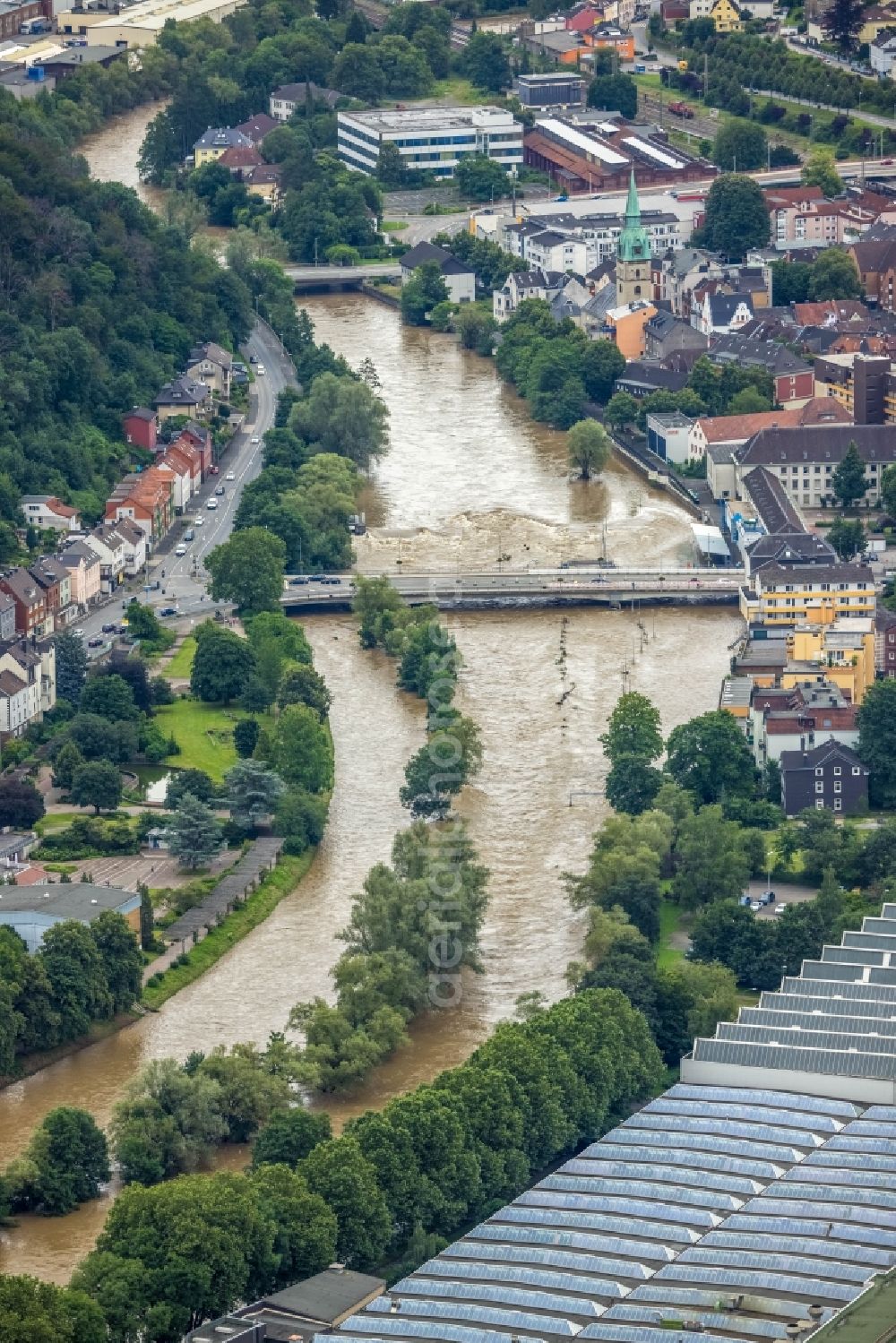 Hagen from above - Flood situation and flooding, all-rousing and infrastructure-destroying masses of brown water in the district Hohenlimburg in Hagen at Ruhrgebiet in the state North Rhine-Westphalia, Germany