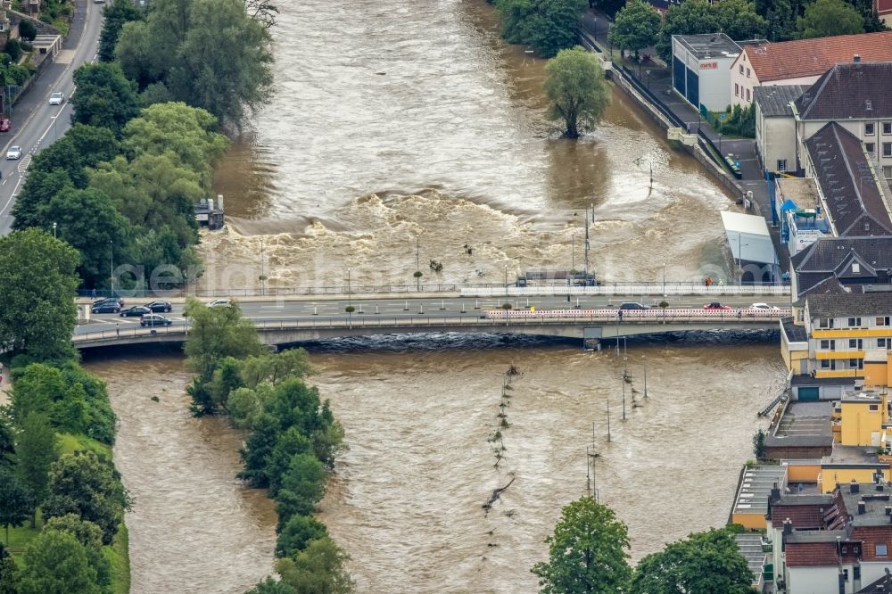 Hagen from the bird's eye view: Flood situation and flooding, all-rousing and infrastructure-destroying masses of brown water in the district Hohenlimburg in Hagen at Ruhrgebiet in the state North Rhine-Westphalia, Germany