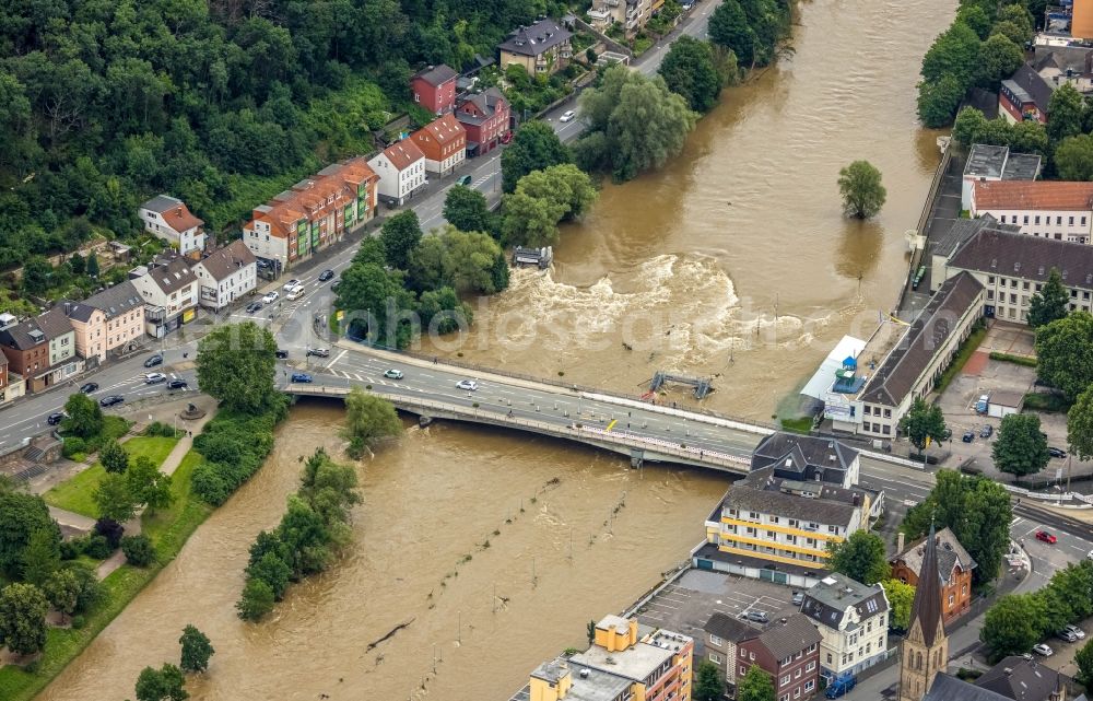 Aerial photograph Hagen - Flood situation and flooding, all-rousing and infrastructure-destroying masses of brown water in the district Hohenlimburg in Hagen at Ruhrgebiet in the state North Rhine-Westphalia, Germany