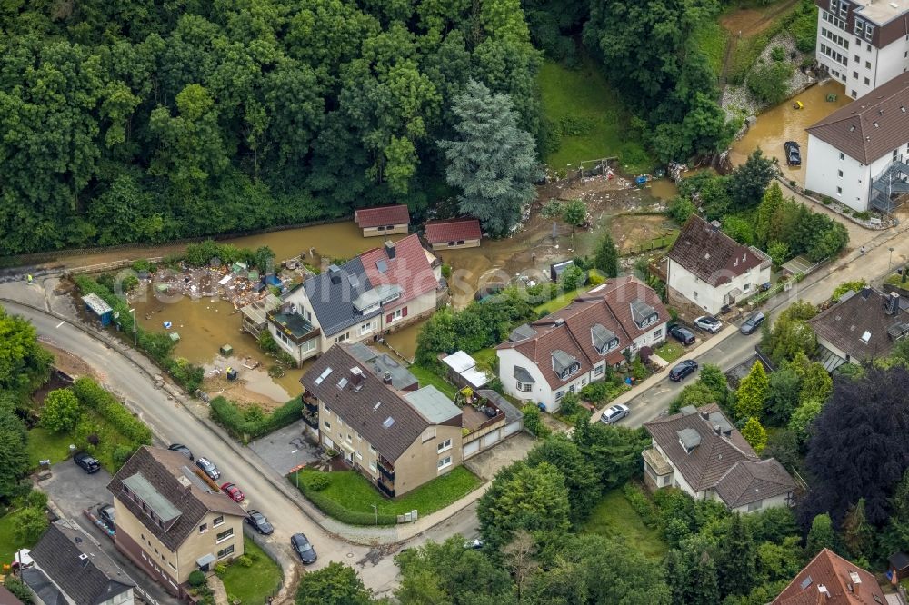 Hagen from above - Flood situation and flooding, all-rousing and infrastructure-destroying masses of brown water in the district Hohenlimburg in Hagen at Ruhrgebiet in the state North Rhine-Westphalia, Germany