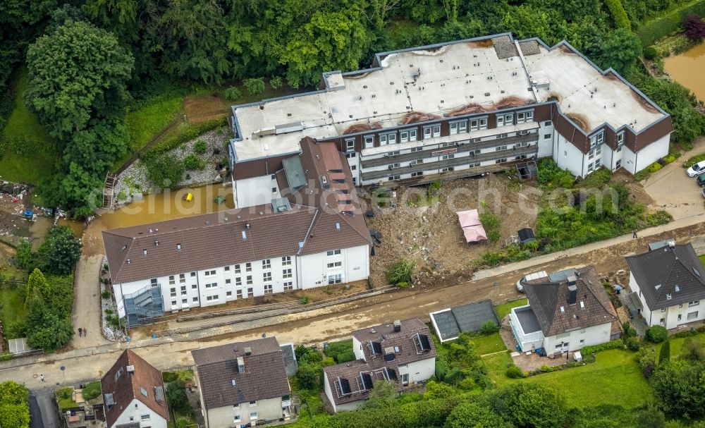 Aerial photograph Hagen - Flood situation and flooding, all-rousing and infrastructure-destroying masses of brown water in the district Hohenlimburg in Hagen at Ruhrgebiet in the state North Rhine-Westphalia, Germany