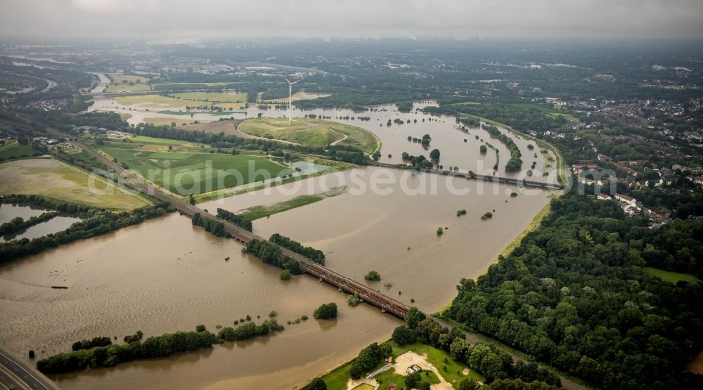 Oberhausen from above - Flood situation and flooding, all-rousing and infrastructure-destroying masses of brown water on the curve of the Ruhr loop in Oberhausen at Ruhrgebiet in the state North Rhine-Westphalia, Germany