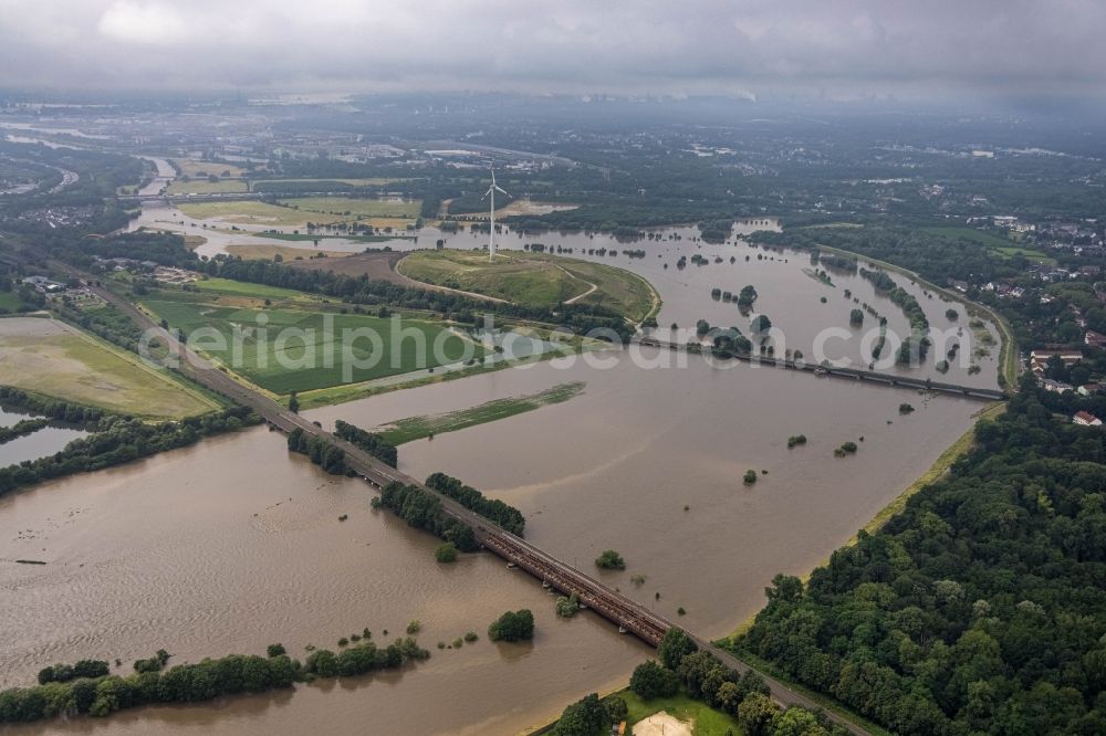 Oberhausen from the bird's eye view: Flood situation and flooding, all-rousing and infrastructure-destroying masses of brown water on the curve of the Ruhr loop in Oberhausen at Ruhrgebiet in the state North Rhine-Westphalia, Germany