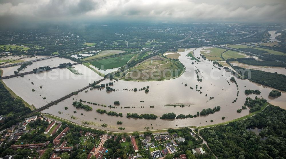 Oberhausen from above - Flood situation and flooding, all-rousing and infrastructure-destroying masses of brown water on the curve of the Ruhr loop in Oberhausen at Ruhrgebiet in the state North Rhine-Westphalia, Germany