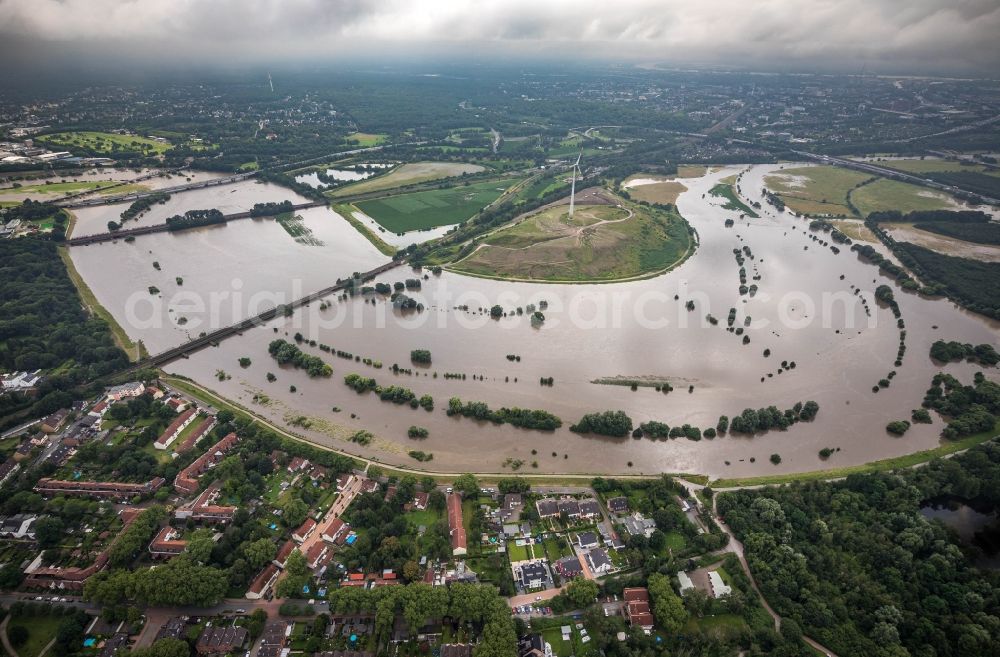 Oberhausen from the bird's eye view: Flood situation and flooding, all-rousing and infrastructure-destroying masses of brown water on the curve of the Ruhr loop in Oberhausen at Ruhrgebiet in the state North Rhine-Westphalia, Germany