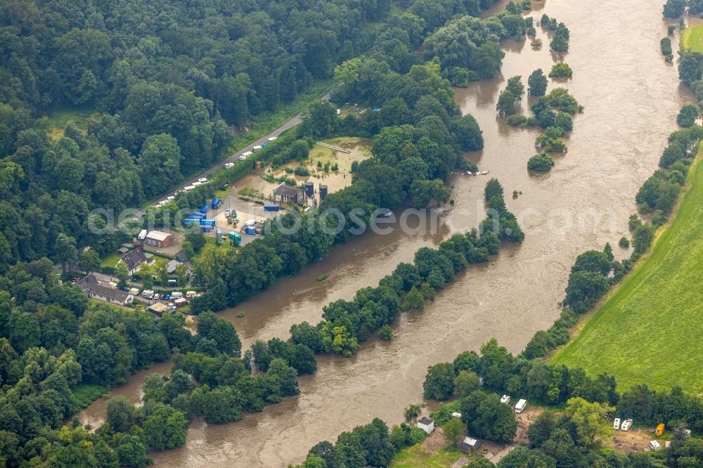 Essen from the bird's eye view: Flood situation and flooding, all-rousing and infrastructure-destroying masses of brown water on Laupendahler Landstrasse in the district Werden in Essen at Ruhrgebiet in the state North Rhine-Westphalia, Germany