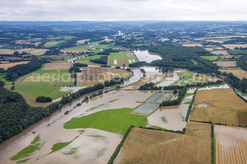 Schwerte from the bird's eye view: Flood situation and flooding, all-rousing and infrastructure-destroying masses of brown water on Ruhr in Schwerte in the state North Rhine-Westphalia, Germany