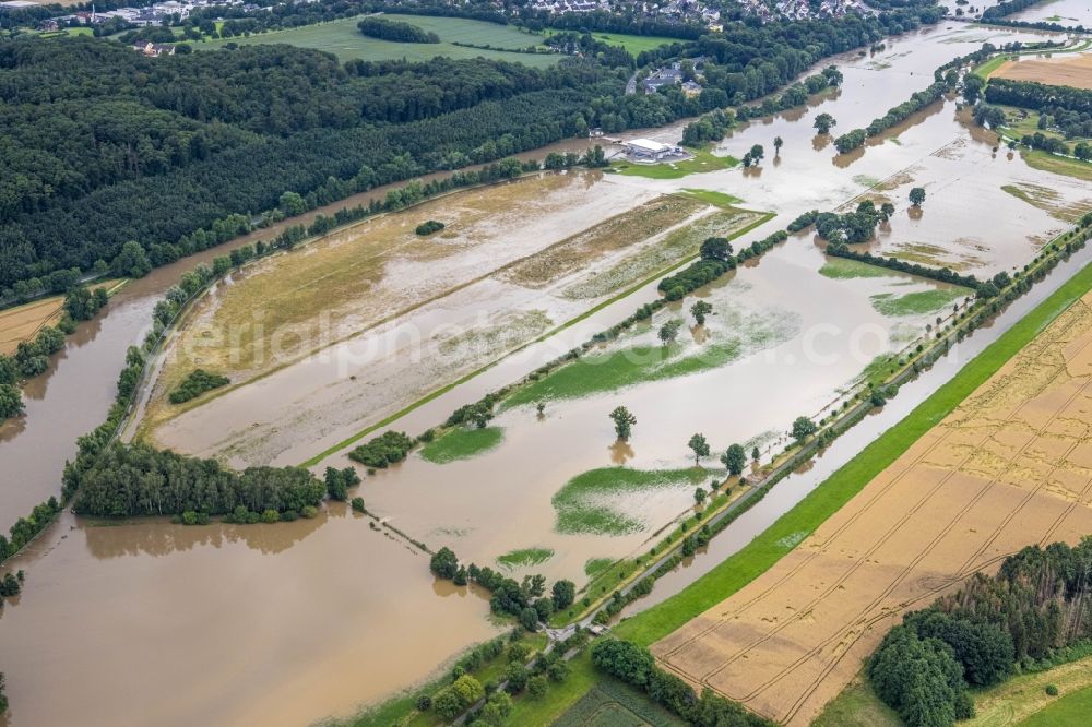 Schwerte from the bird's eye view: Flood situation and flooding, all-rousing and infrastructure-destroying masses of brown water on Ruhr in Schwerte in the state North Rhine-Westphalia, Germany