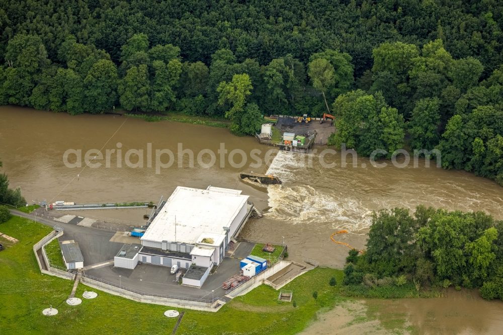 Aerial photograph Schwerte - Flood situation and flooding, all-rousing and infrastructure-destroying masses of brown water on Ruhr in Schwerte in the state North Rhine-Westphalia, Germany