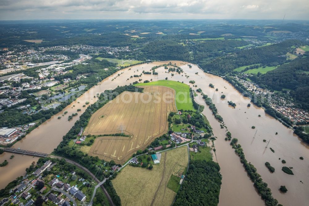 Aerial photograph Hattingen - Flood situation and flooding, all-rousing and infrastructure-destroying masses of brown water at the loop of the river course of the Ruhr in Hattingen at Ruhrgebiet in the state North Rhine-Westphalia, Germany