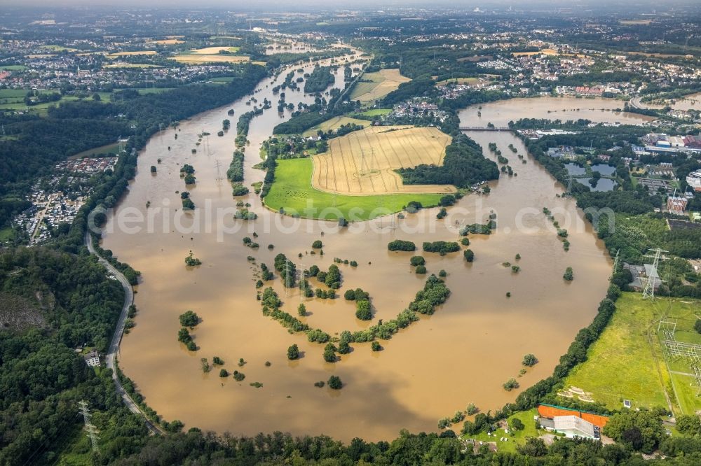 Hattingen from the bird's eye view: Flood situation and flooding, all-rousing and infrastructure-destroying masses of brown water at the loop of the river course of the Ruhr in Hattingen at Ruhrgebiet in the state North Rhine-Westphalia, Germany