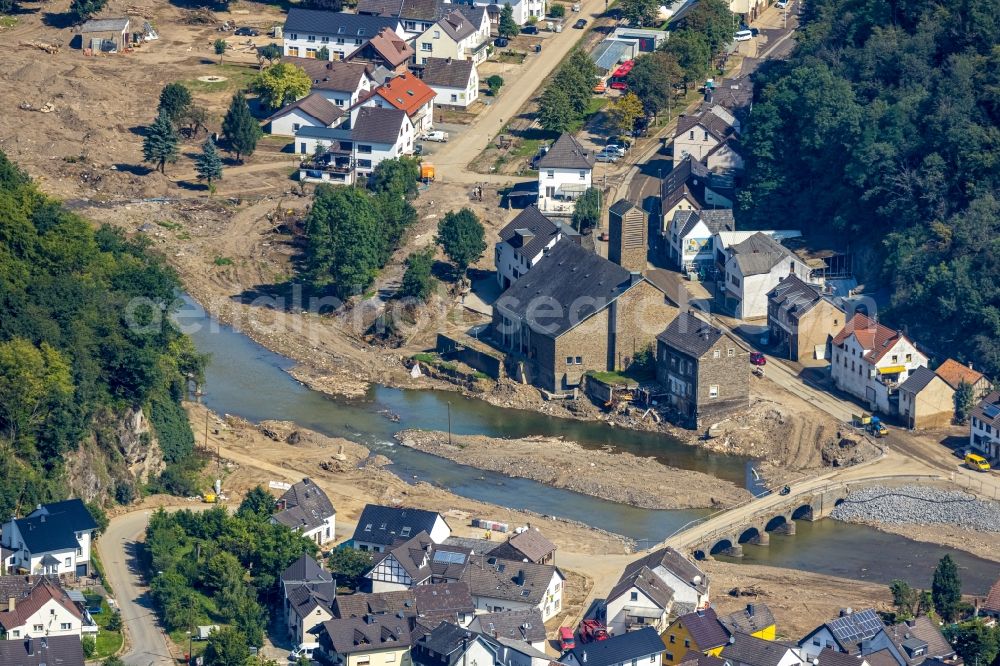 Aerial photograph Ahrbrück - Flood damage and reconstruction construction sites in the floodplain on shore of Ahr in Ahrbrueck in the state Rhineland-Palatinate, Germany