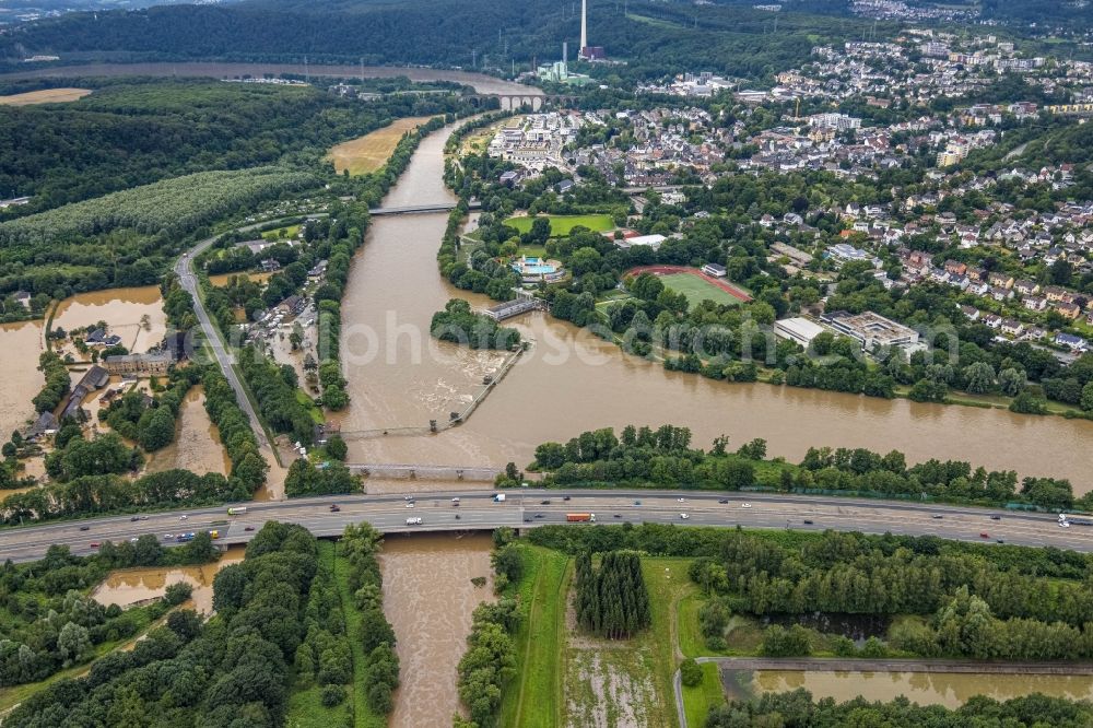 Herdecke from the bird's eye view: Flood situation and flooding, all-rousing and infrastructure-destroying masses of brown water on the banks of the Ruhr in Herdecke in the state North Rhine-Westphalia, Germany