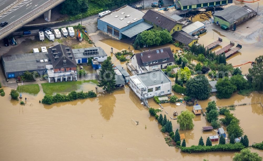 Aerial image Hattingen - Flood situation and flooding, all-rousing and infrastructure-destroying masses of brown water on the course of the Ruhr in Hattingen at Ruhrgebiet in the state North Rhine-Westphalia, Germany