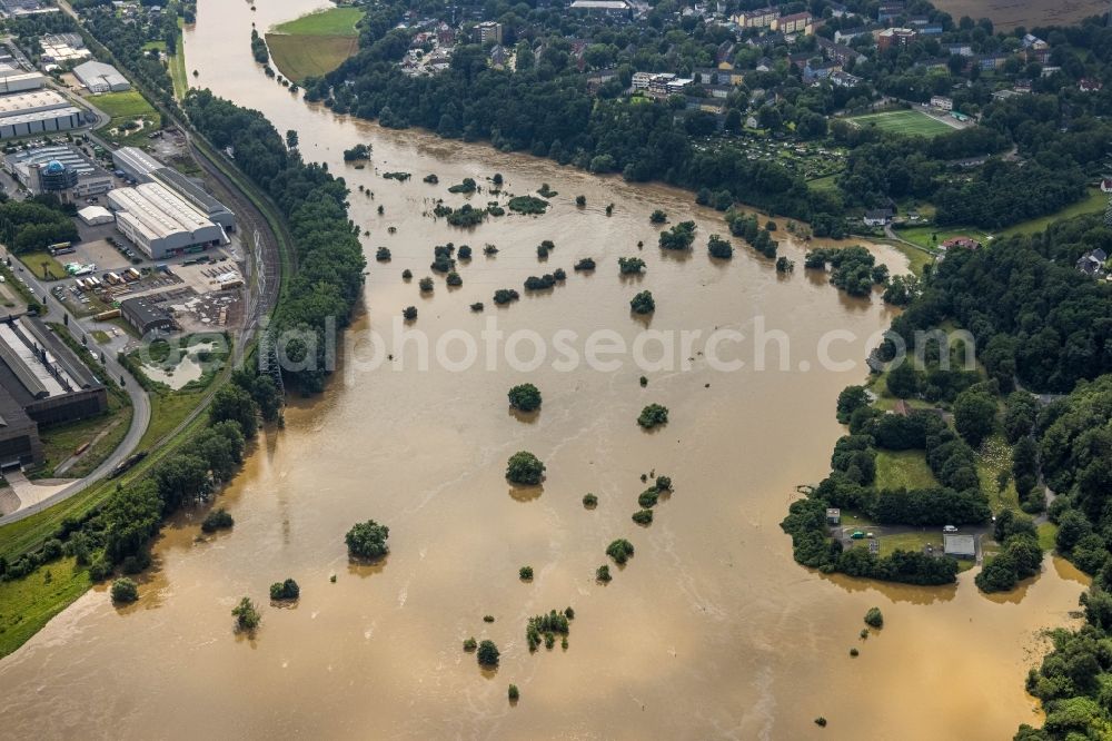 Hattingen from above - Flood situation and flooding, all-rousing and infrastructure-destroying masses of brown water on the course of the Ruhr in Hattingen at Ruhrgebiet in the state North Rhine-Westphalia, Germany