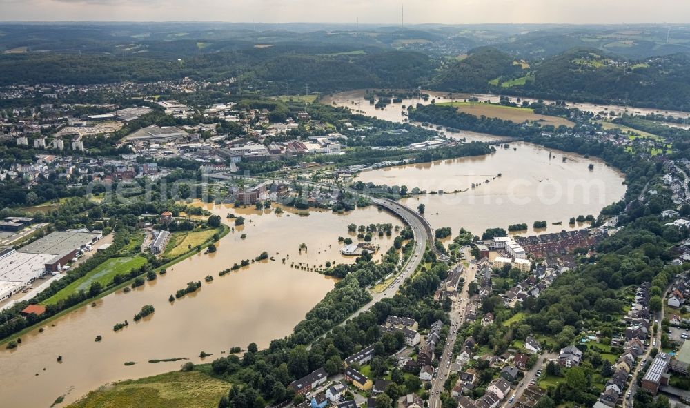 Hattingen from the bird's eye view: Flood situation and flooding, all-rousing and infrastructure-destroying masses of brown water on the course of the Ruhr in Hattingen at Ruhrgebiet in the state North Rhine-Westphalia, Germany