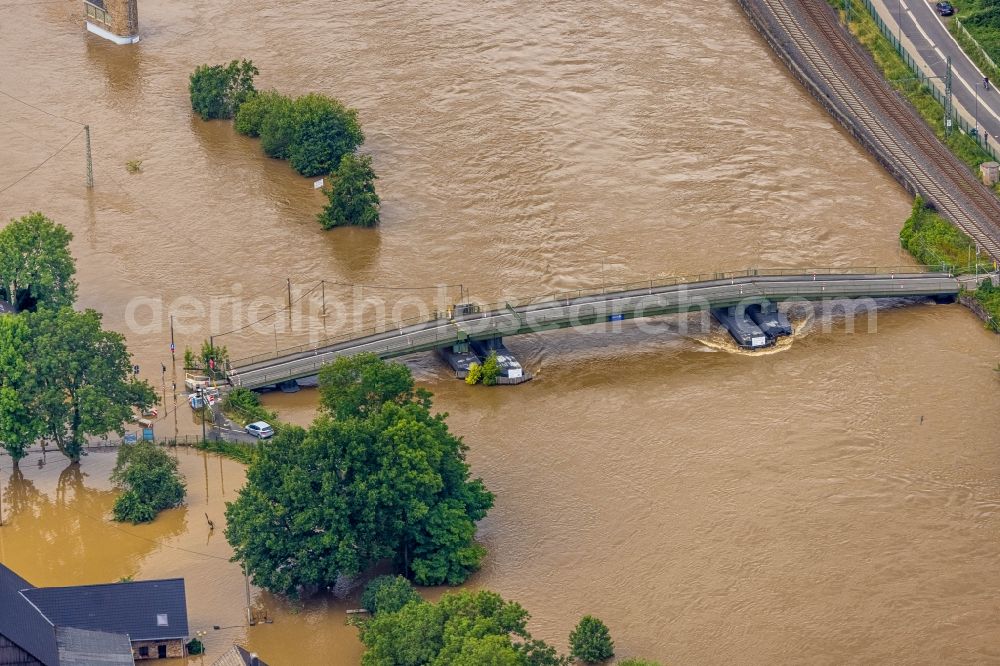 Hattingen from the bird's eye view: Flood situation and flooding, all-rousing and infrastructure-destroying masses of brown water on the course of the Ruhr in Hattingen at Ruhrgebiet in the state North Rhine-Westphalia, Germany