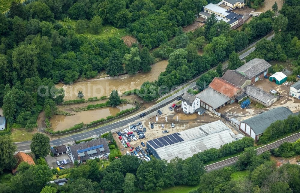 Aerial image Hagen - Flood situation and flooding, all-rousing and infrastructure-destroying masses of brown water on the course of the Ruhr and Volme in Hagen at Ruhrgebiet in the state North Rhine-Westphalia, Germany