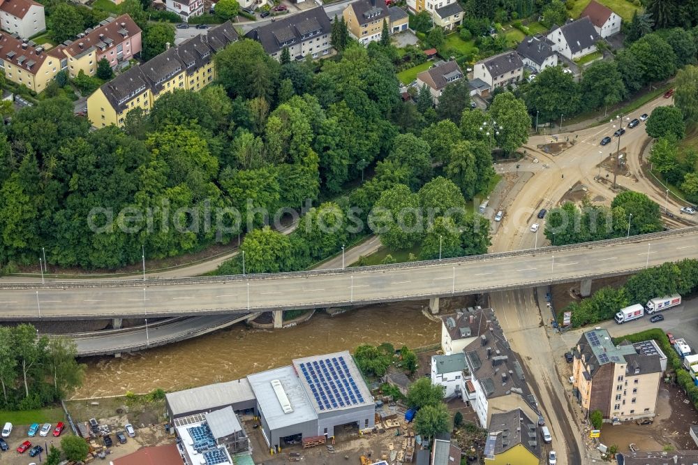 Hagen from the bird's eye view: Flood situation and flooding, all-rousing and infrastructure-destroying masses of brown water on the course of the Ruhr and Volme in Hagen at Ruhrgebiet in the state North Rhine-Westphalia, Germany