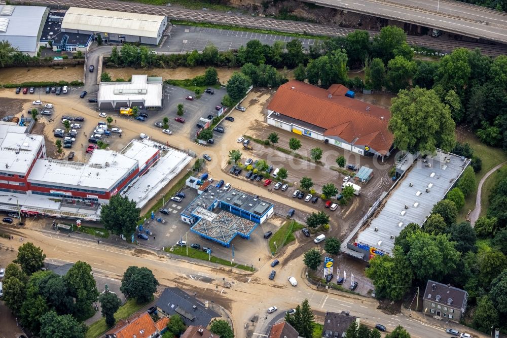 Hagen from the bird's eye view: Flood situation and flooding, all-rousing and infrastructure-destroying masses of brown water on the course of the Ruhr and Volme in Hagen at Ruhrgebiet in the state North Rhine-Westphalia, Germany