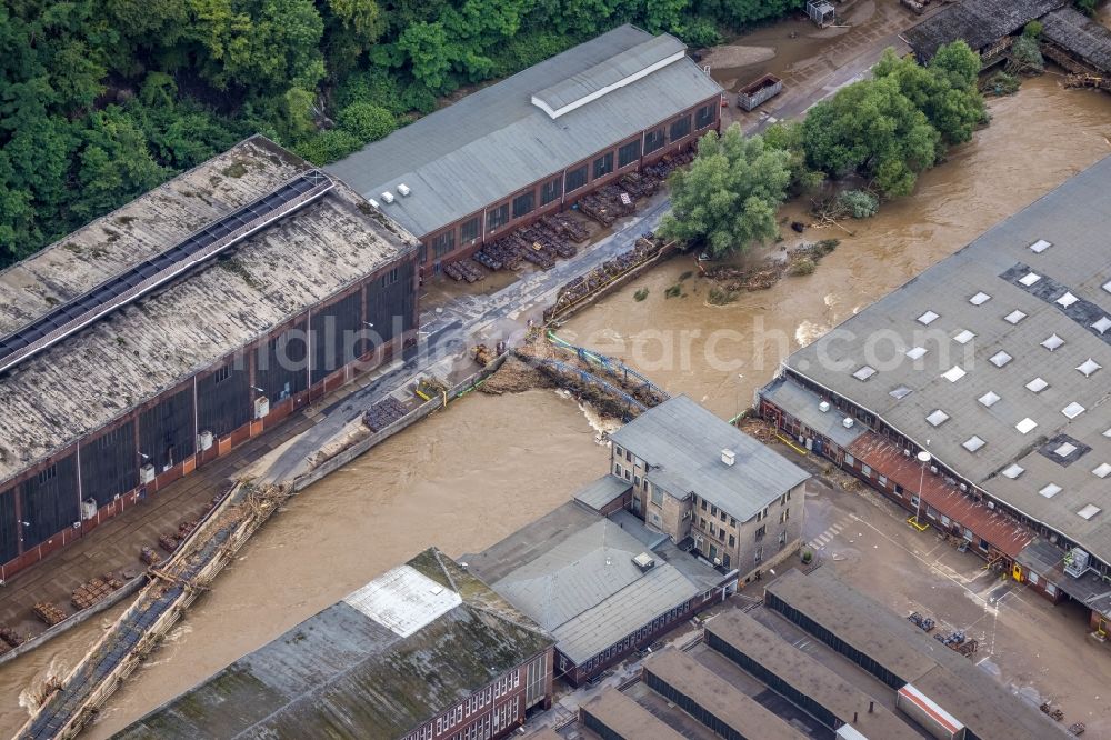 Aerial photograph Hagen - Flood situation and flooding, all-rousing and infrastructure-destroying masses of brown water on the course of the Ruhr and Volme in Hagen at Ruhrgebiet in the state North Rhine-Westphalia, Germany