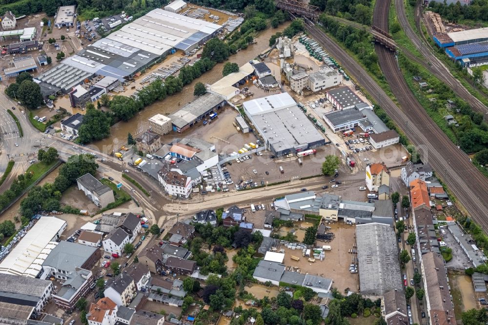 Hagen from the bird's eye view: Flood situation and flooding, all-rousing and infrastructure-destroying masses of brown water on the course of the Ruhr and Volme in Hagen at Ruhrgebiet in the state North Rhine-Westphalia, Germany