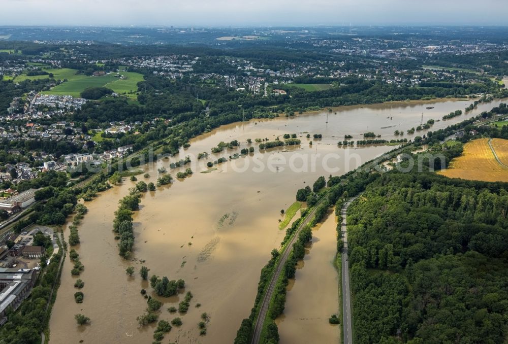 Witten from the bird's eye view: Flood situation and flooding, all-rousing and infrastructure-destroying masses of brown water on the course of the Ruhr in Witten at Ruhrgebiet in the state North Rhine-Westphalia, Germany