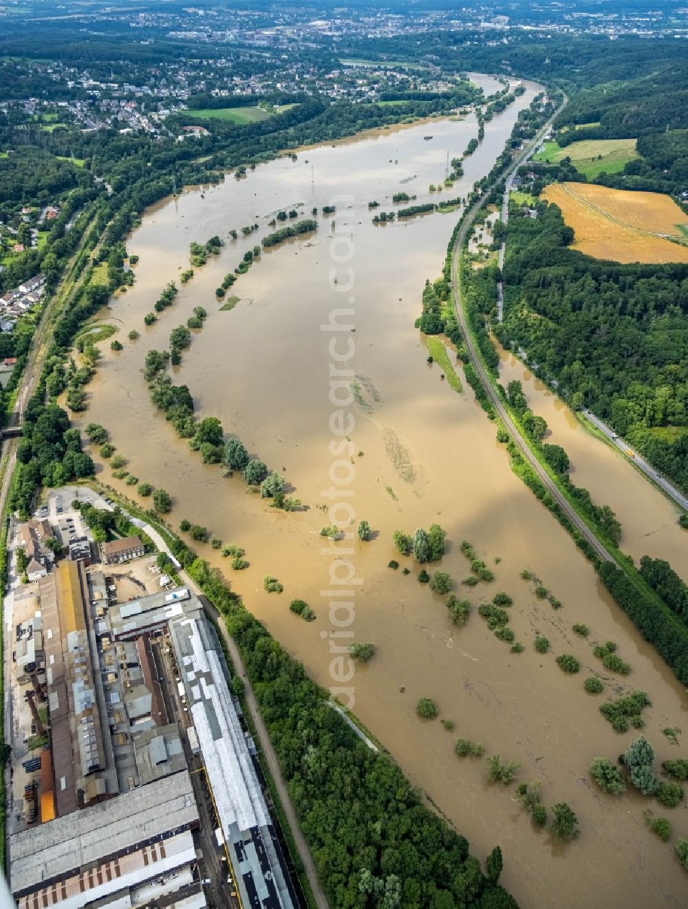 Witten from above - Flood situation and flooding, all-rousing and infrastructure-destroying masses of brown water on the course of the Ruhr in Witten at Ruhrgebiet in the state North Rhine-Westphalia, Germany