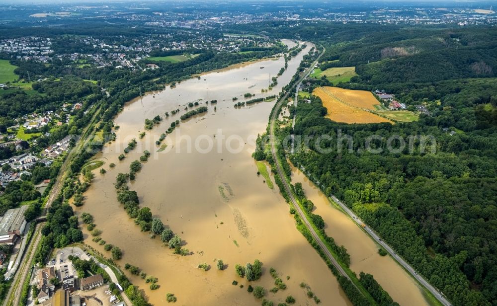 Witten from the bird's eye view: Flood situation and flooding, all-rousing and infrastructure-destroying masses of brown water on the course of the Ruhr in Witten at Ruhrgebiet in the state North Rhine-Westphalia, Germany