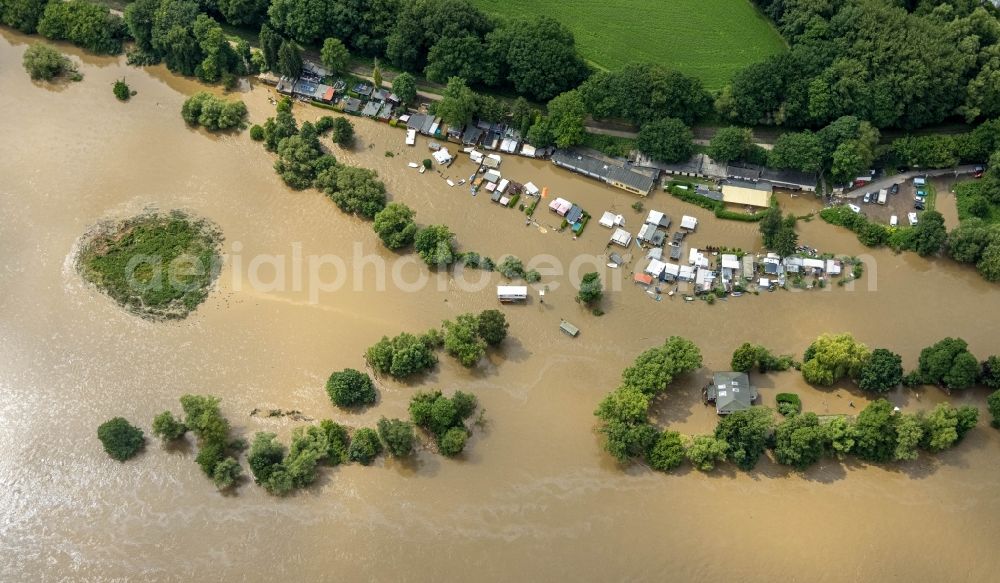 Witten from the bird's eye view: Flood situation and flooding, all-rousing and infrastructure-destroying masses of brown water on the course of the Ruhr in Witten at Ruhrgebiet in the state North Rhine-Westphalia, Germany