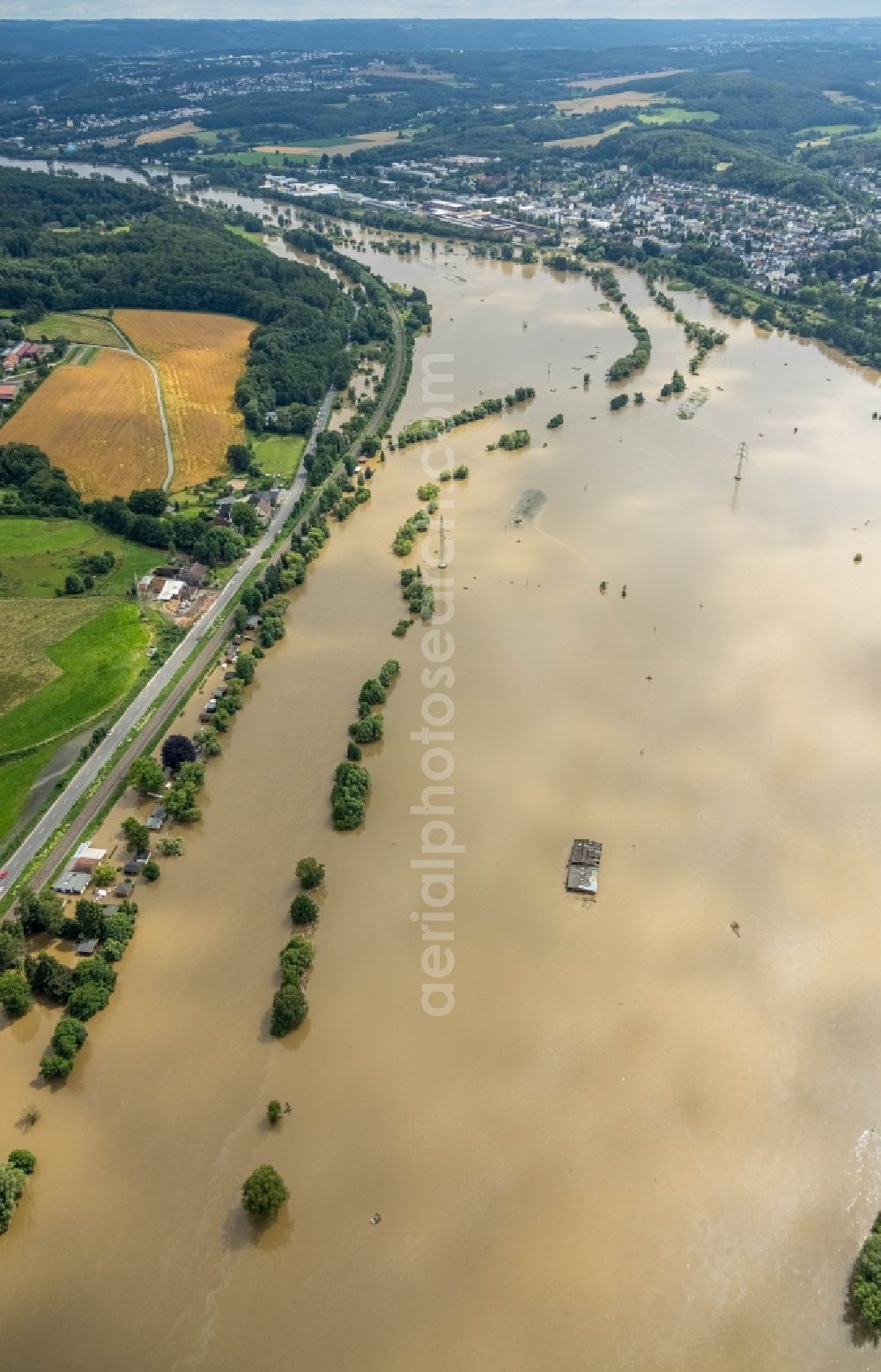 Aerial image Witten - Flood situation and flooding, all-rousing and infrastructure-destroying masses of brown water on the course of the Ruhr in Witten at Ruhrgebiet in the state North Rhine-Westphalia, Germany