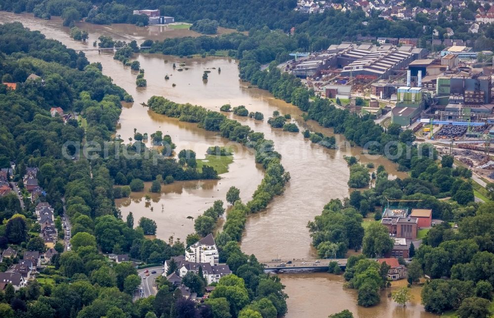 Witten from the bird's eye view: Flood situation and flooding, all-rousing and infrastructure-destroying masses of brown water on the course of the Ruhr in Witten at Ruhrgebiet in the state North Rhine-Westphalia, Germany