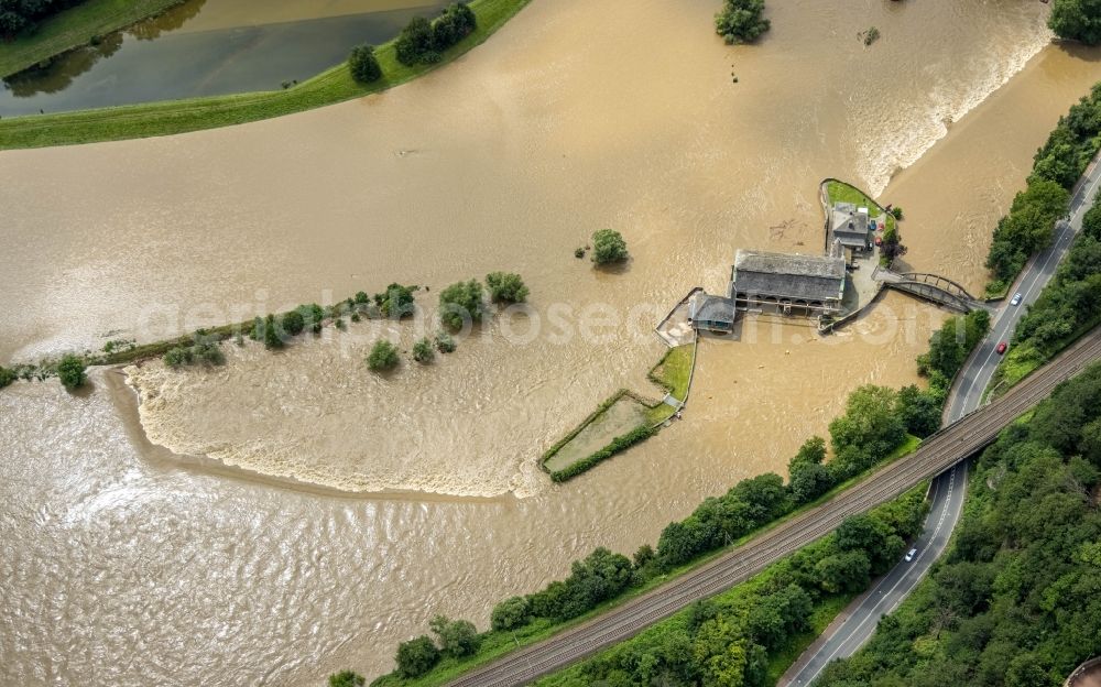 Aerial photograph Witten - Flood situation and flooding, all-rousing and infrastructure-destroying masses of brown water on the course of the Ruhr in Witten at Ruhrgebiet in the state North Rhine-Westphalia, Germany