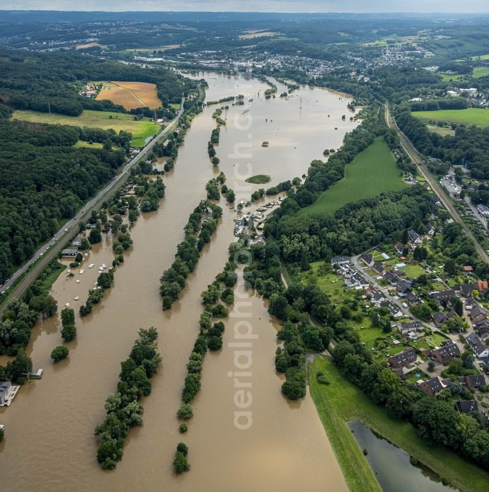 Witten from the bird's eye view: Flood situation and flooding, all-rousing and infrastructure-destroying masses of brown water on the course of the Ruhr in Witten at Ruhrgebiet in the state North Rhine-Westphalia, Germany