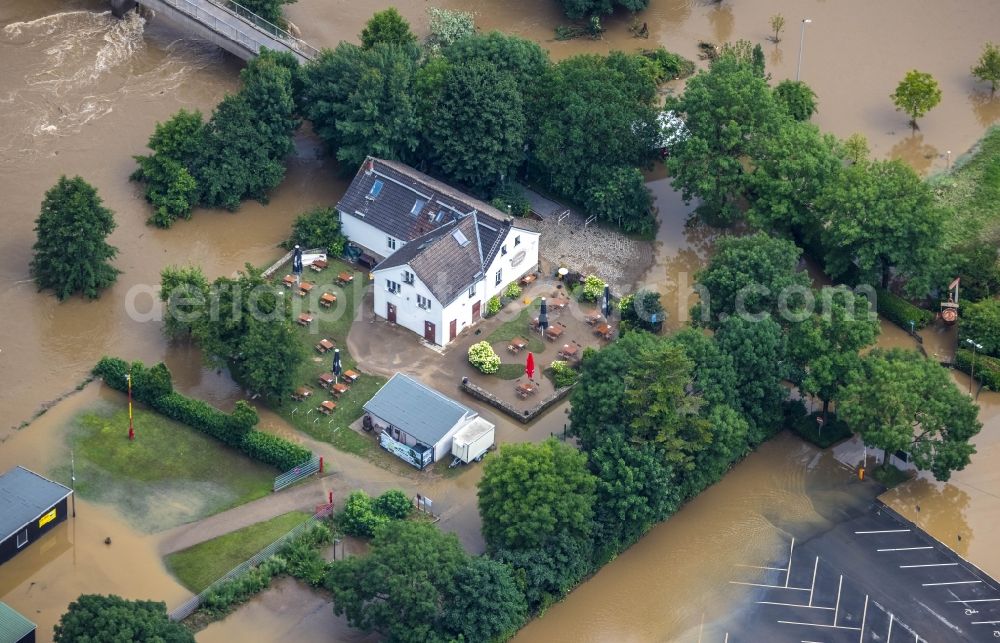 Aerial photograph Witten - Flood situation and flooding, all-rousing and infrastructure-destroying masses of brown water at the Zollhaus on Lakebruecke at Ruhrtal in the district Herbede in Witten at Ruhrgebiet in the state North Rhine-Westphalia, Germany