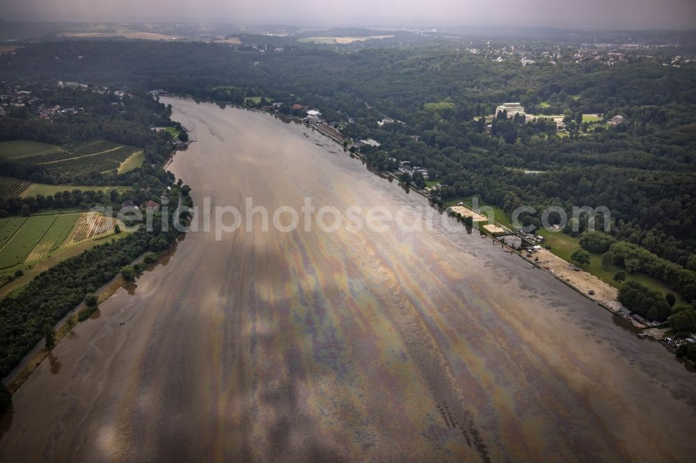 Essen from above - Flood situation of the inundating, all-moving and infrastructure-destroying brown water masses with extensive oil spill on the water surface of the Baldeneysee in the district Bredeney in Essen in the Ruhr area in the state North Rhine-Westphalia, Germany