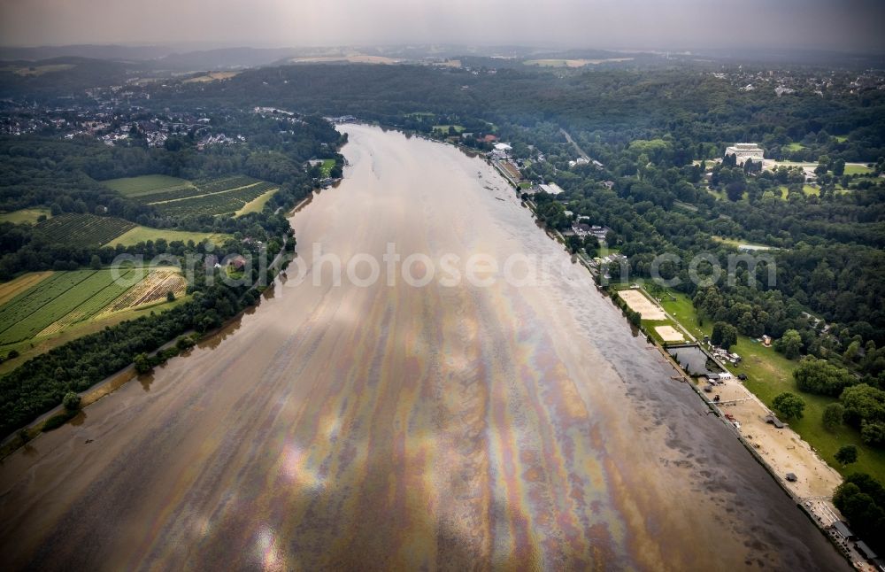 Aerial photograph Essen - Flood situation of the inundating, all-moving and infrastructure-destroying brown water masses with extensive oil spill on the water surface of the Baldeneysee in the district Bredeney in Essen in the Ruhr area in the state North Rhine-Westphalia, Germany