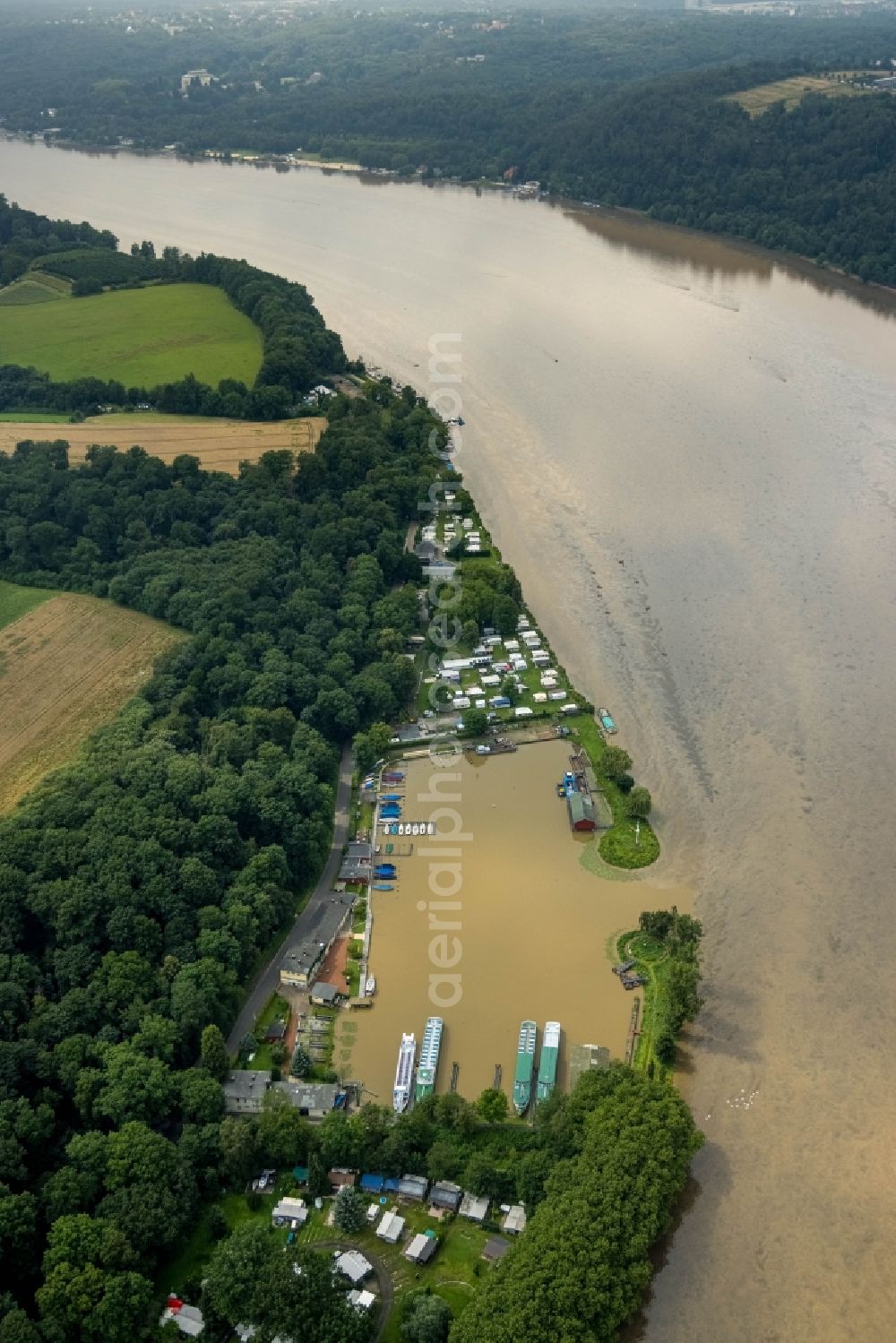 Aerial image Essen - Flood situation of the inundating, all-moving and infrastructure-destroying brown water masses with extensive oil spill on the water surface of the Baldeneysee in the district Bredeney in Essen in the Ruhr area in the state North Rhine-Westphalia, Germany