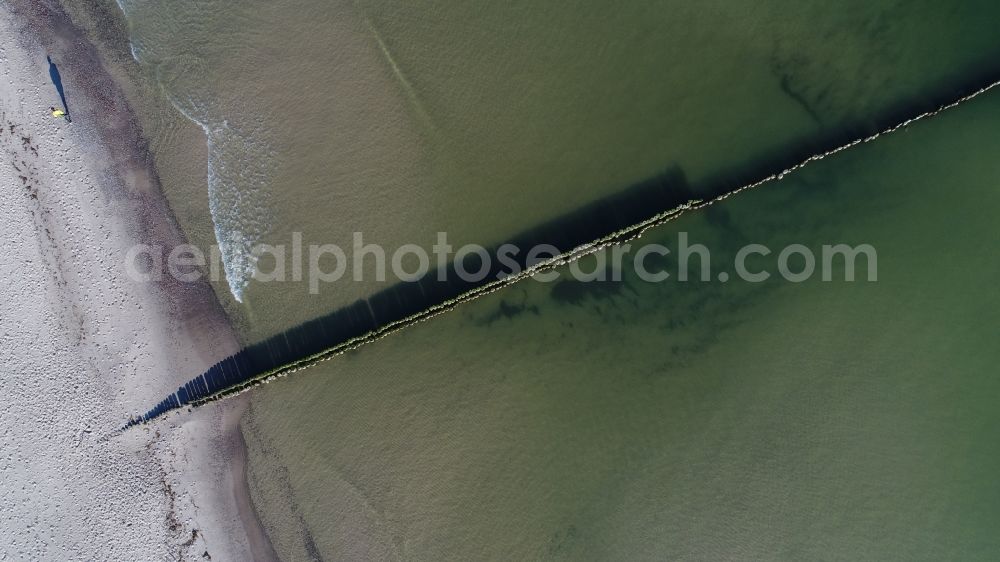 Aerial image Koserow - Wooden groynes row on the surface of the water at the of Baltic Sea seashore in Koserow in the state Mecklenburg - Western Pomerania, Germany