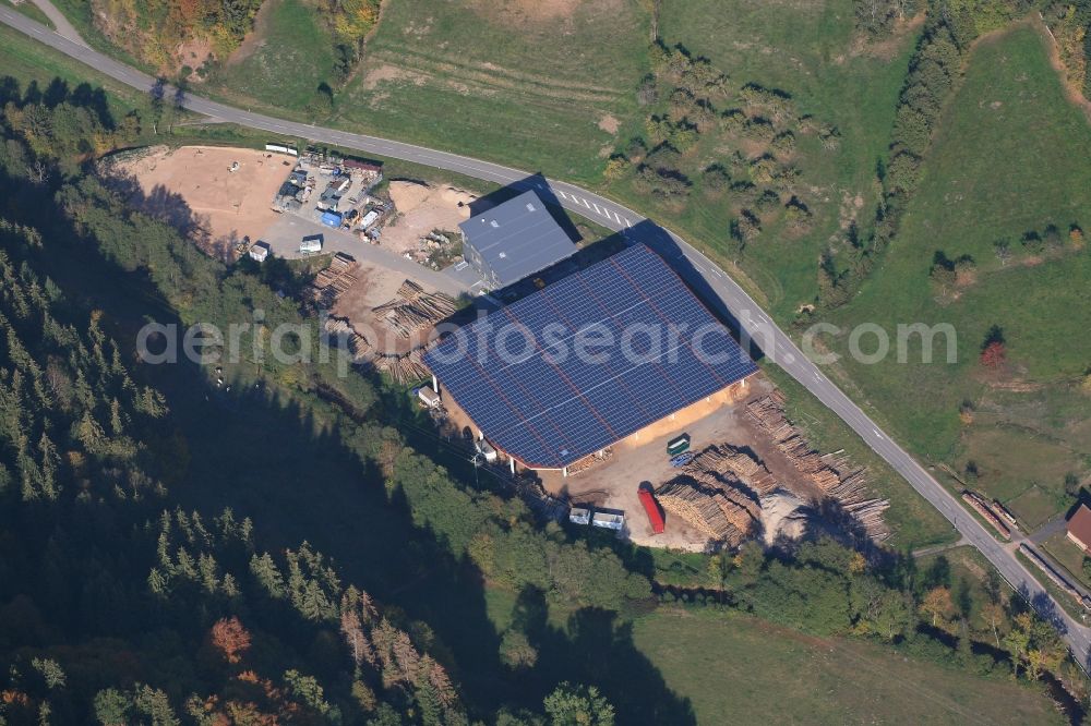 Aerial image Kleines Wiesental - Wood and trunk storage area and with photovoltaic covered roof for wood chips in the industrial areal in the district Niedertegernau in Kleines Wiesental in the state Baden-Wurttemberg, Germany