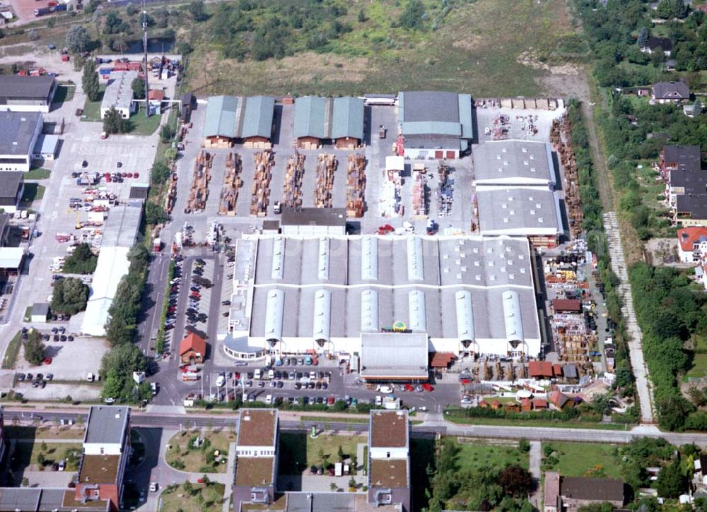 Berlin - Mahlsdorf from the bird's eye view: 20.08.2002 Holzmarkt der Fa. Holz - Possling GmbH & Co. KG an der Landsberger Straße 9 in 12623 BERLIN