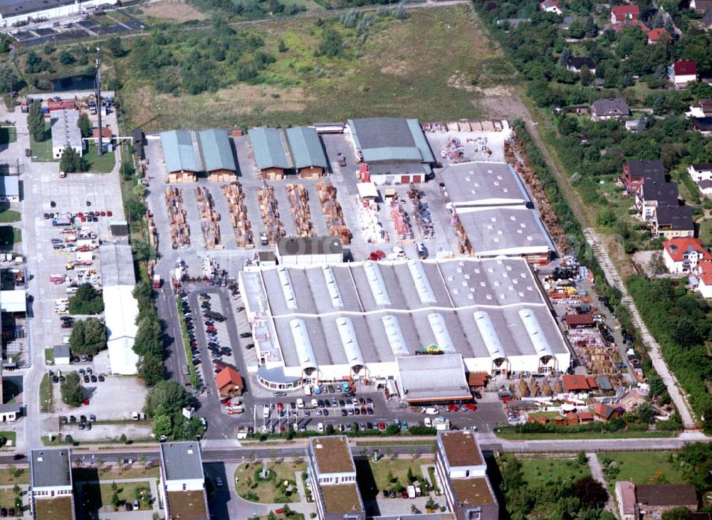 Berlin - Mahlsdorf from the bird's eye view: 20.08.2002 Holzmarkt der Fa. Holz - Possling GmbH & Co. KG an der Landsberger Straße 9 in 12623 BERLIN