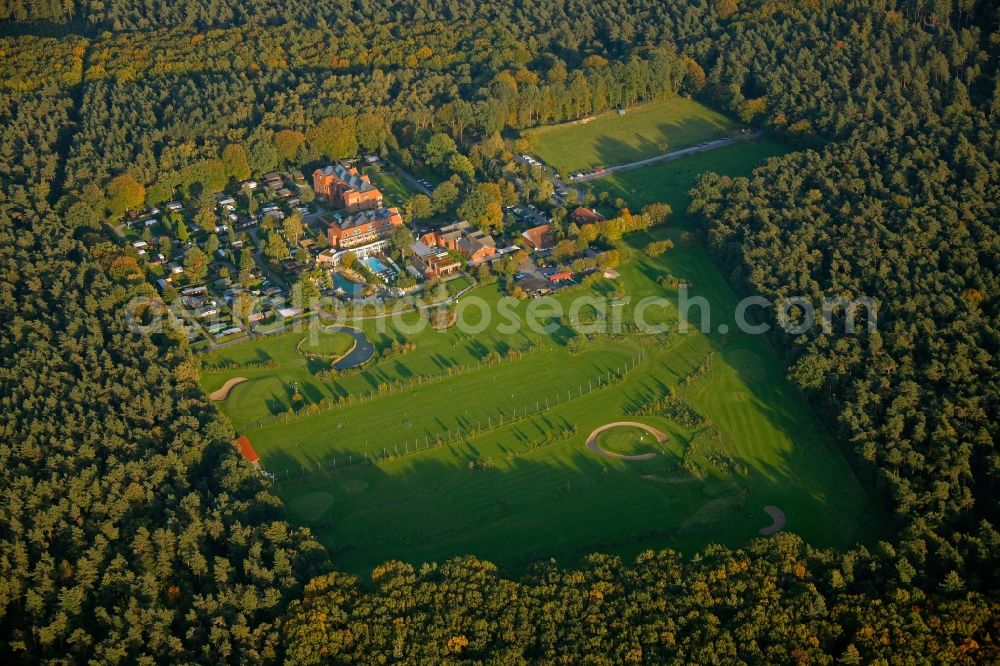 Datteln from the bird's eye view: Hotel complex with golf course of Schnieder e.K. in a wooded area in Datteln in North Rhine-Westphalia