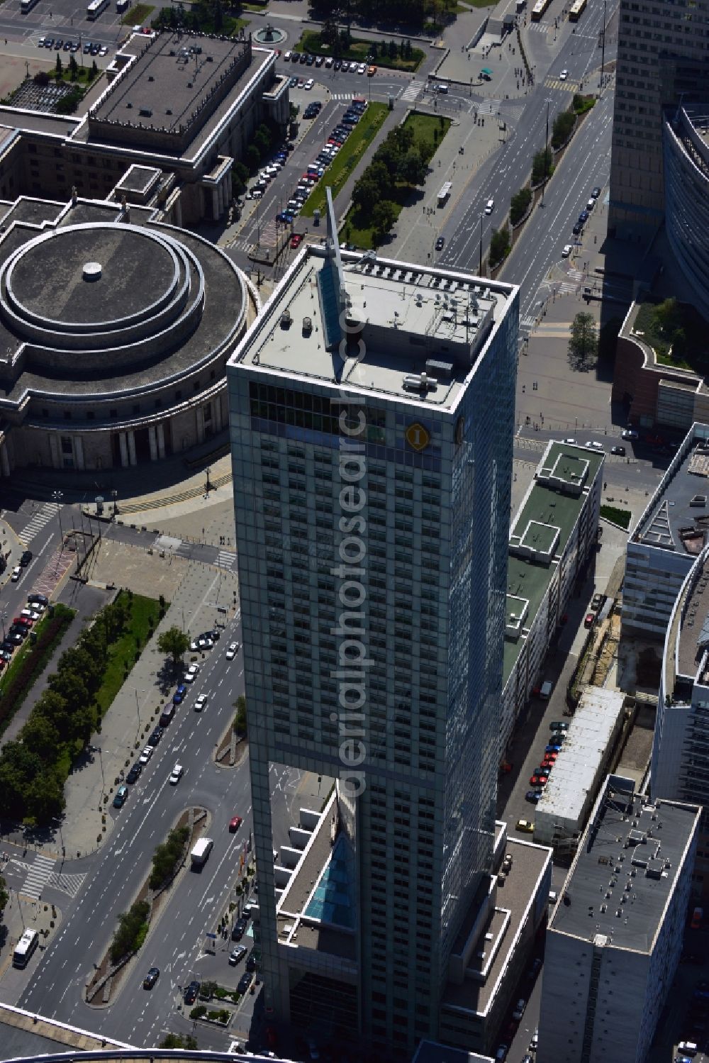 Aerial photograph Warschau - Hotel InterContinental in downtown Warsaw in Poland. The five-star-hotel is a landmark of the city and the third-largest hotel in Europe. It was built under the construction company Porr AG from 2001 until 2003. It is 164 m high and covers 45 floors. Its most distinct feature is the gap in its lower floors which was constructed to guarantee sunlight for the smaller buildings behind it